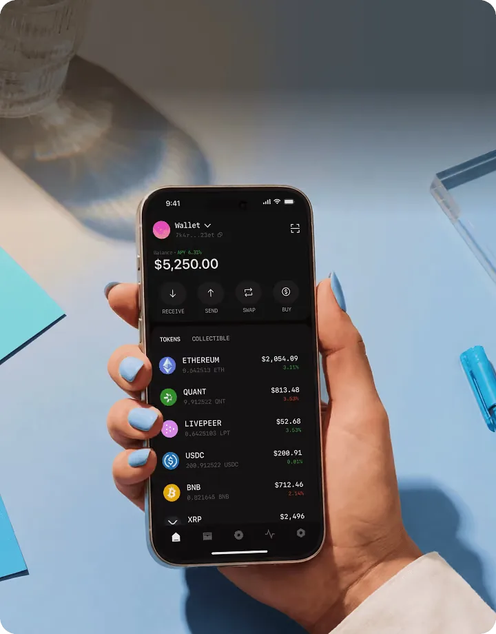 Hand holding a phone with a crypto wallet app